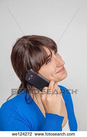 Teen girl talking on a smart phone. View Large Photo Image Stock Image - Teen girl talking on a smart phone.. Fotosearch
