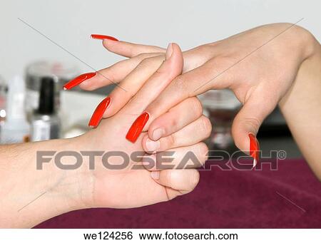 Woman in a Nail Salon Receiving a Manicure. View Large Photo Image Stock Photograph - Woman in a Nail Salon Receiving a Manicure.. Fotosearch