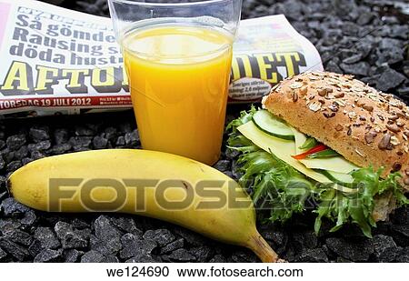 Breakfast including sandwich, orange juice and coffee and a newspaper to read. View Large Photo Image Stock Image - Breakfast including sandwich, orange juice and coffee and a newspaper to read.. Fotosearch