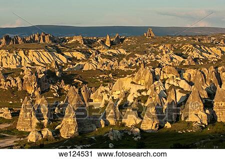 Landscape with eroded tuff rock formations, UNESCO World Heritage site G÷reme National Park and the Rock Sites of Cappadocia, Cappadocia, Turkey View Large Photo Image Stock Image - Landscape with eroded tuff rock formations, UNESCO World Heritage site G÷reme National Park and the Rock Sites of Cappadocia, Cappadocia, Turkey. Fotosearch