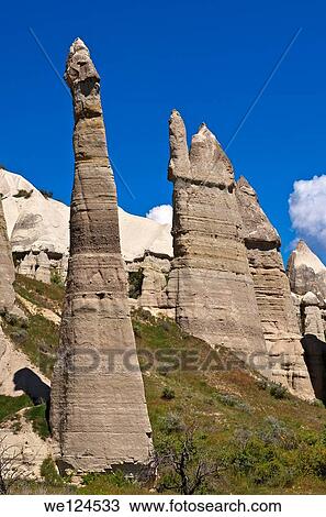 Stock Image - Tuff rock formations or fairy chimneys in the Love Valley Ask Vadisi near Uchisar, UNESCO World Heritage site G÷reme National Park and the Rock Sites of Cappadocia, Cappadocia, Turkey. Fotosearch