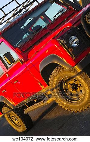 Stock Image - A nice red Landrover. Fotosearch