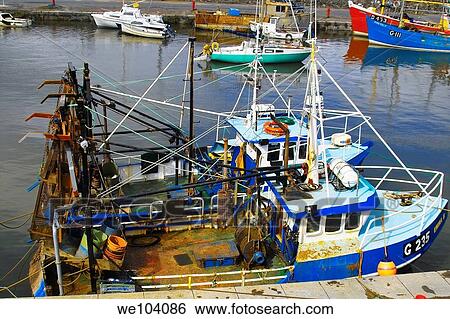 A pair of blue trawlers at Balbriggan Harbour, Co Dublin, Ireland View Large Photo Image Stock Photograph - A pair of blue trawlers at Balbriggan Harbour, Co Dublin, Ireland. Fotosearch