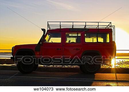 A red landrover silhouetted in the sunset View Large Photo Image Stock Image - A red landrover silhouetted in the sunset. Fotosearch