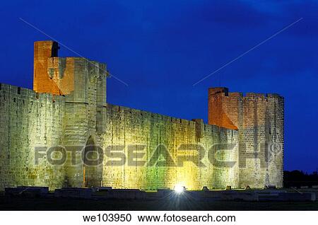 Stock Image - Aigues Mortes walls at Dusk Petit Camargue, Gard department, Languedoc-Roussillon Region France. Fotosearch