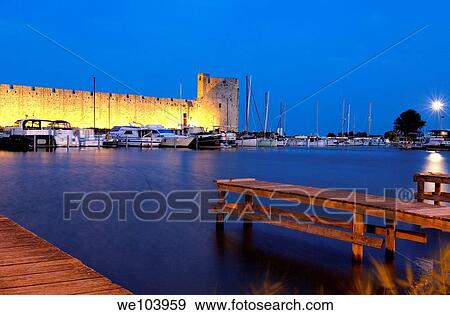 Aigues Mortes walls at Dusk Petit Camargue, Gard department, Languedoc-Roussillon Region France View Large Photo Image Stock Photo - Aigues Mortes walls at Dusk Petit Camargue, Gard department, Languedoc-Roussillon Region France. Fotosearch