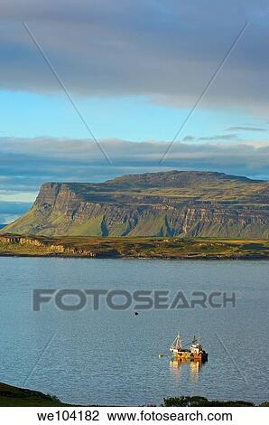 Boat at sunset in Loch Scridian, Mull, Inner Hebrides, Argyll and Bute, Scotland, United Kingdom, Europe View Large Photo Image Stock Image - Boat at sunset in Loch Scridian, Mull, Inner Hebrides, Argyll and Bute, Scotland, United Kingdom, Europe. Fotosearch