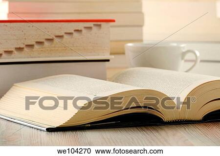 Stock Image - Composition with harcover book on the table. Fotosearch