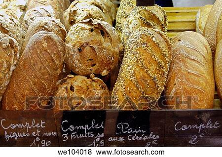 Stock Photo - Different kinds of French bread in a bakery in Paris France. Fotosearch