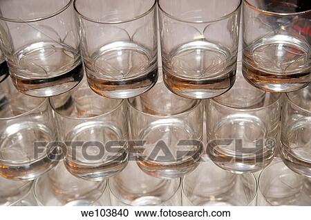 Empty water glasses lined up in rows View Large Photo Image Stock Image - Empty water glasses lined up in rows. Fotosearch