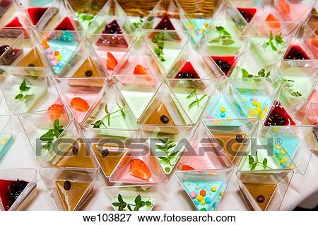 Fancy desserts in triangle containers View Large Photo Image Stock Photo - Fancy desserts in triangle containers. Fotosearch