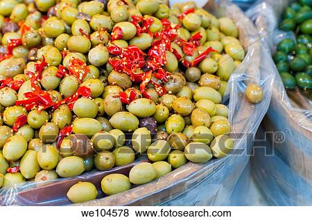 Green olives with spicy red peppers View Large Photo Image Stock Photo - Green olives with spicy red peppers. Fotosearch