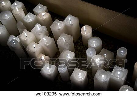 Lit white candles View Large Photo Image Stock Photography - Lit white candles. Fotosearch