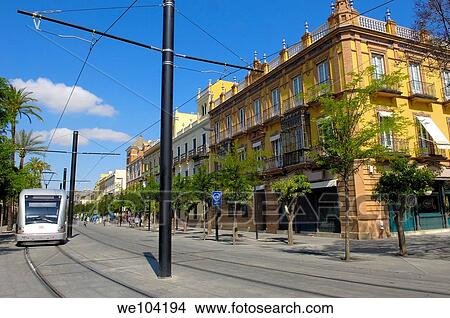 Modern tramway ´electrico´ at San Fernando street, Seville, Andalusia, Spain View Large Photo Image Picture - Modern tramway ´electrico´ at San Fernando street, Seville, Andalusia, Spain. Fotosearch