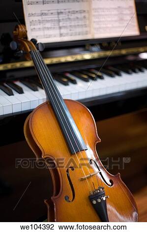 Stock Image - piano, violin and score. Fotosearch