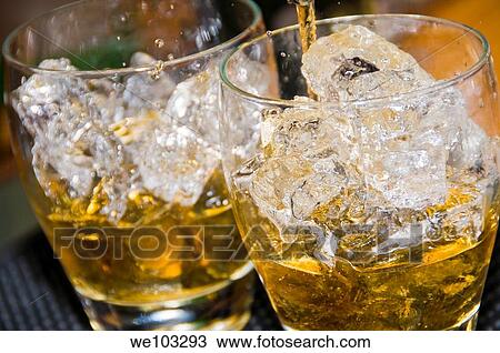 Rum and coke on ice, close-up View Large Photo Image Stock Image - Rum and coke on ice, close-up. Fotosearch
