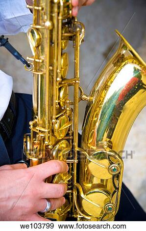 Saxophone player playing music View Large Photo Image Stock Photo - Saxophone player playing music. Fotosearch