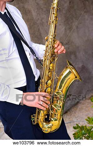 Saxophone player playing music View Large Photo Image Stock Photograph - Saxophone player playing music. Fotosearch