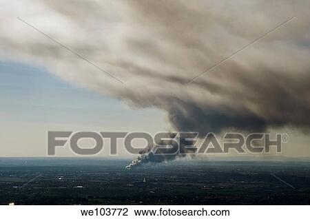 Stock Image - Smoke from a fire in the distance Rome Italy. Fotosearch