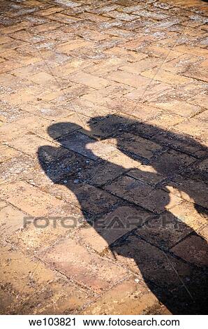 The shadow of a couple kissing in love View Large Photo Image Stock Image - The shadow of a couple kissing in love. Fotosearch