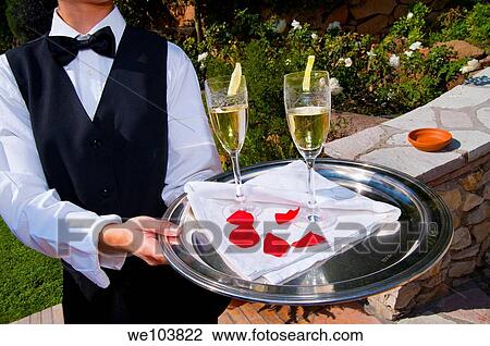 Waiter offering newlyweds chilled drinks View Large Photo Image Stock Image - Waiter offering newlyweds chilled drinks. Fotosearch