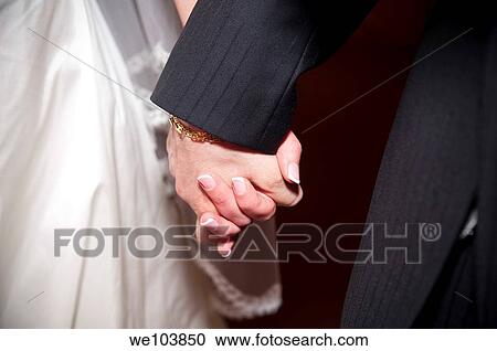 Wedding couple holding hands View Large Photo Image Stock Image - Wedding couple holding hands. Fotosearch