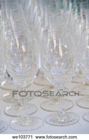 Wine glasses lined up in rows View Large Photo Image Stock Image - Wine glasses lined up in rows. Fotosearch