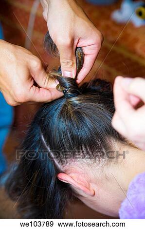 Woman getting a braid done View Large Photo Image Stock Photo - Woman getting a braid done. Fotosearch