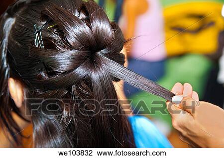 Stock Image - Woman getting her hair done. Fotosearch