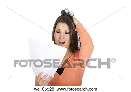 A beautiful Caucasian woman upset about incoming bills View Large Photo Image Stock Photo - A beautiful Caucasian woman upset about incoming bills. Fotosearch