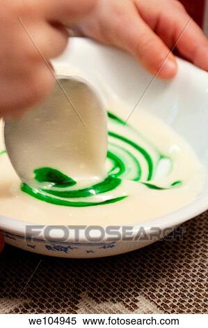 A child mixes food coloring into homemade icing View Large Photo Image Stock Photography - A child mixes food coloring into homemade icing. Fotosearch