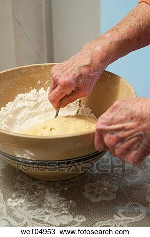An old woman stirring cookie dough View Large Photo Image Stock Image - An old woman stirring cookie dough. Fotosearch