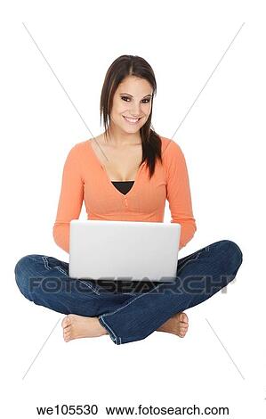 Attractive young girl using notebook computer on white background View Large Photo Image Stock Image - Attractive young girl using notebook computer on white background. Fotosearch