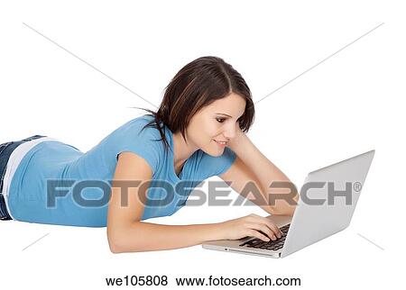 Attractive young girl using notebook computer on white background View Large Photo Image Stock Photo - Attractive young girl using notebook computer on white background. Fotosearch