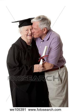 Beauitiful Caucasian woman in a black graduation gown with her husband View Large Photo Image Stock Image - Beauitiful Caucasian woman in a black graduation gown with her husband. Fotosearch