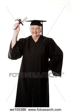 Stock Photograph - Beauitiful Caucasian woman in a black graduation gown. Fotosearch