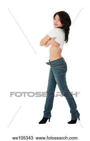Beautiful and sexy Asian woman posing with some attitude on a white background View Large Photo Image Stock Image - Beautiful and sexy Asian woman posing with some attitude on a white background. Fotosearch