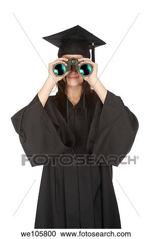 Beautiful Caucasian woman wearing in a black graduation gown and looking through binoculars View Large Photo Image Stock Image - Beautiful Caucasian woman wearing in a black graduation gown and looking through binoculars. Fotosearch