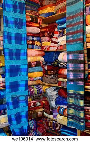 Bright colorful collection of cloth wraps in a Fes Medina Morocco textile shop View Large Photo Image Picture - Bright colorful collection of cloth wraps in a Fes Medina Morocco textile shop. Fotosearch