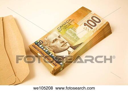 Brown Paper Envelope next to a stack of Ten Thousand dollars in Canadian One-Hundred Dollar Currency Bank Notes, Studio Composition View Large Photo Image Stock Photo - Brown Paper Envelope next to a stack of Ten Thousand dollars in Canadian One-Hundred Dollar Currency Bank Notes, Studio Composition. Fotosearch