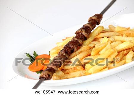 Char grilled chicken hearts Shish Kebab Skewer with french fries View Large Photo Image Stock Photo - Char grilled chicken hearts Shish Kebab Skewer with french fries. Fotosearch