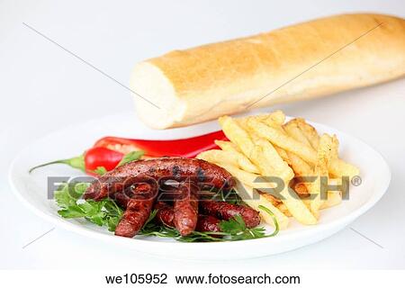 Char Grilled Merguez sausages with french fries View Large Photo Image Stock Image - Char Grilled Merguez sausages with french fries. Fotosearch