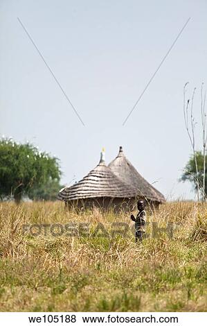 child and huts in southern sudan View Large Photo Image Stock Photo - child and huts in southern sudan. Fotosearch