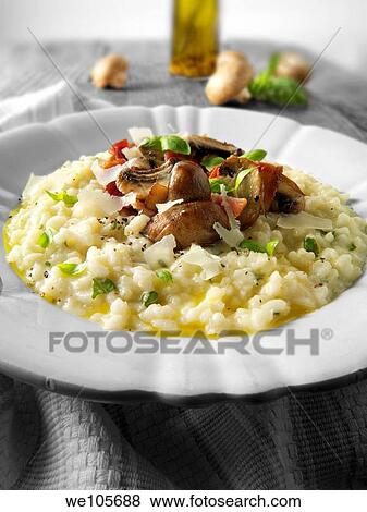 Classic risotto with wild porcini mushrooms and bacon View Large Photo Image Stock Photo - Classic risotto with wild porcini mushrooms and bacon. Fotosearch