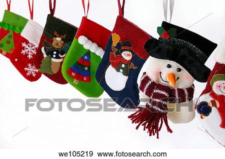 Collection of Christmas stockings with snowmen hanging on white background View Large Photo Image Stock Photo - Collection of Christmas stockings with snowmen hanging on white background. Fotosearch