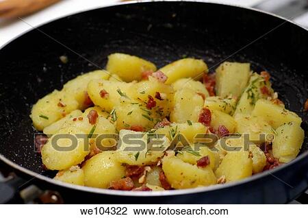 Cooking hot potatoes with bacon basil and walnut View Large Photo Image Stock Image - Cooking hot potatoes with bacon basil and walnut. Fotosearch