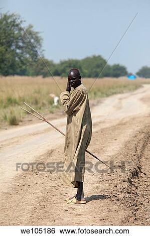 Dinka cattle herder, Lilir Sudan, December 2010 View Large Photo Image Stock Photograph - Dinka cattle herder, Lilir Sudan, December 2010. Fotosearch