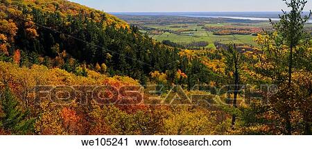 Stock Image - Eardley Escarpment and Ottawa River valley in Fall at Tawadina Lookout Gatineau Park panorama. Fotosearch