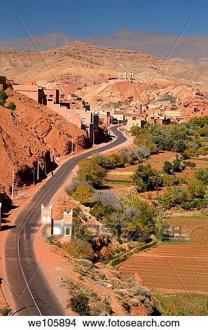 Picture - Farmland and red rock hills along road in Dades Gorge in the High Atlas mountains Morocco. Fotosearch