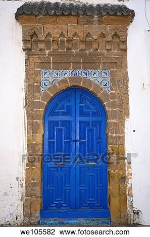 Fresh painted blue door with stonework and tiles in Essaouira Medina on white building, Morocco View Large Photo Image Stock Image - Fresh painted blue door with stonework and tiles in Essaouira Medina on white building, Morocco. Fotosearch